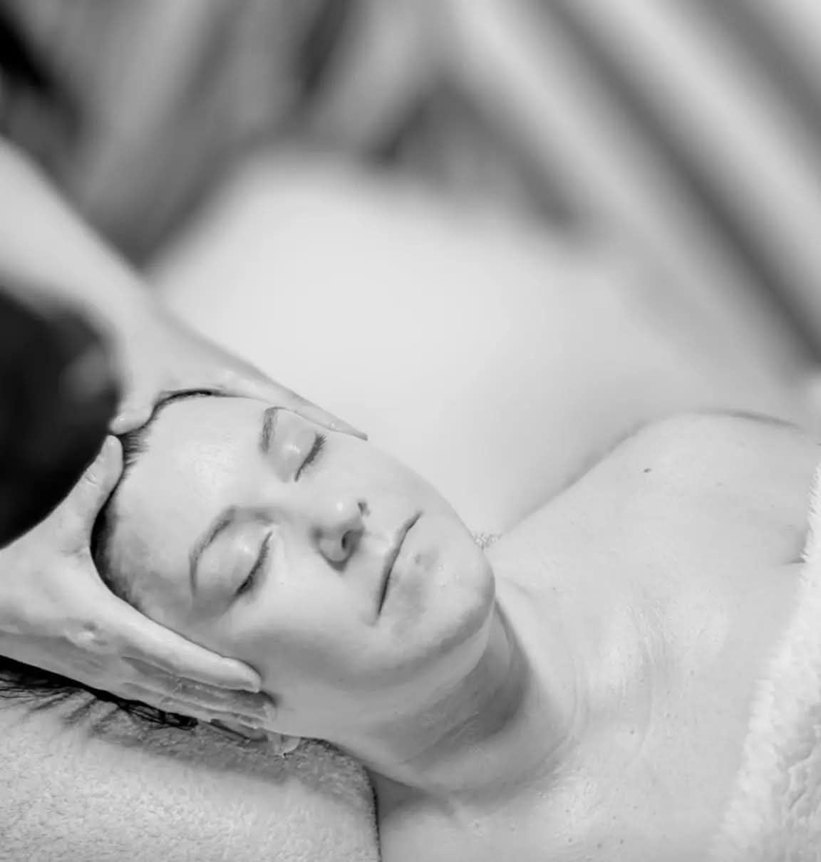 Ruth McKibben performing a relaxing facial massage