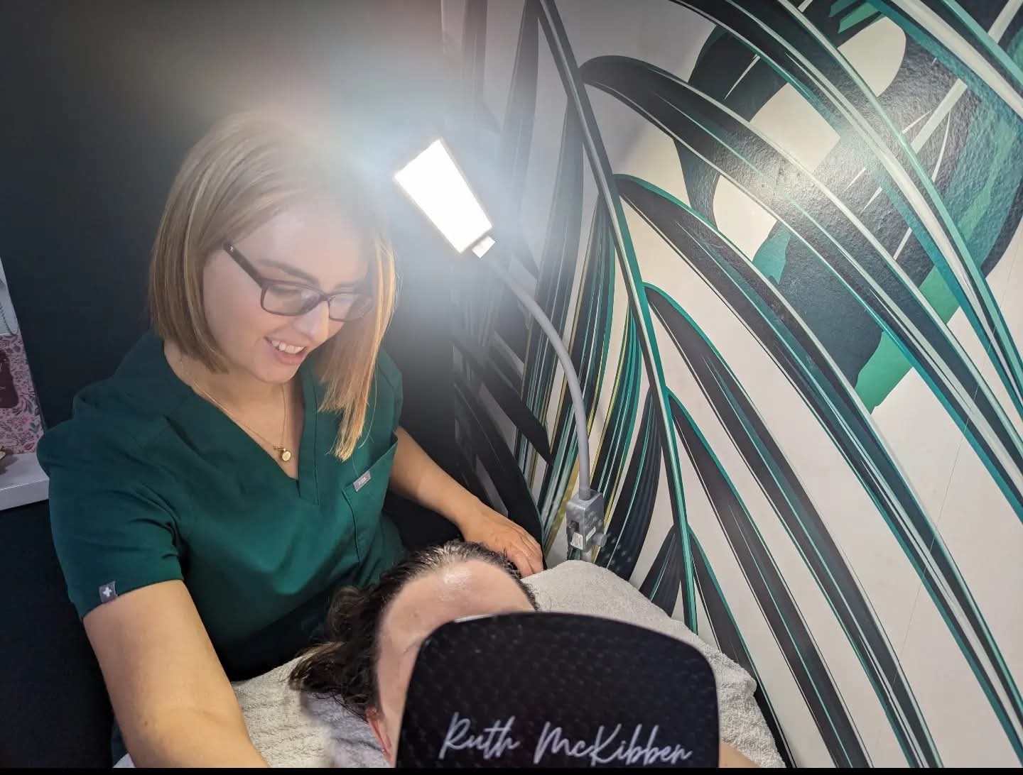 Ruth McKibben performing a brow treatment